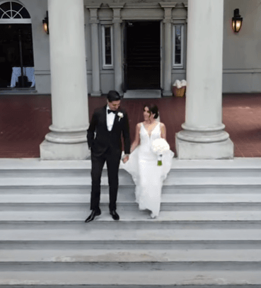 couple walking out of the hycroft manor after wedding ceremony